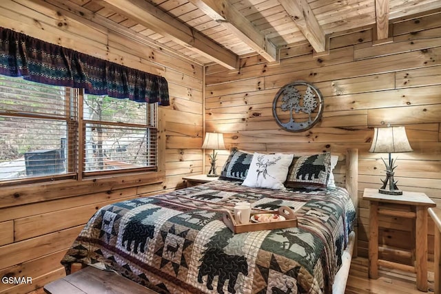 bedroom with wooden ceiling, beamed ceiling, wood walls, and wood finished floors
