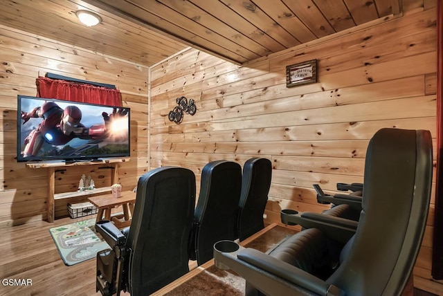 cinema with wooden walls, wooden ceiling, and wood finished floors