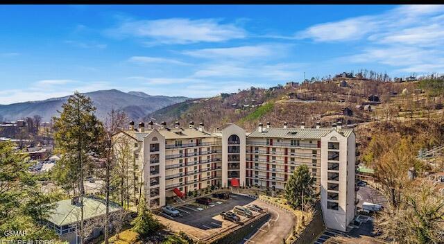 102 Baskins Creek Byp Unit 104, Gatlinburg, TN 37738 - view of building exterior with a mountain view