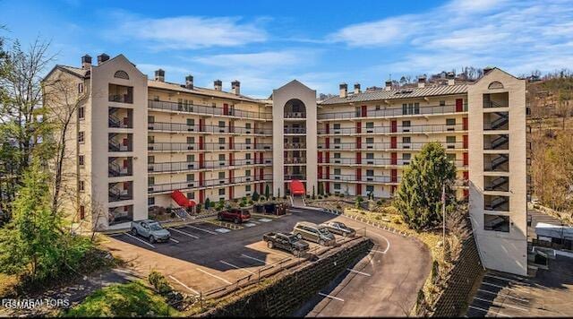 102 Baskins Creek Byp Unit 104, Gatlinburg, TN 37738 - view of apartment building / complex with uncovered parking