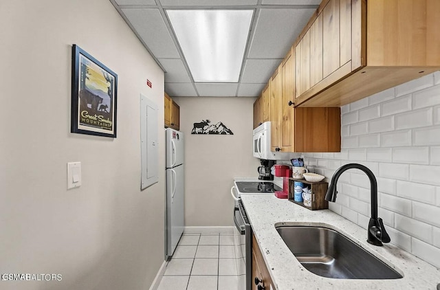 102 Baskins Creek Byp Unit 104, Gatlinburg, TN 37738 - kitchen with a sink, white appliances, backsplash, light tile patterned flooring, and baseboards