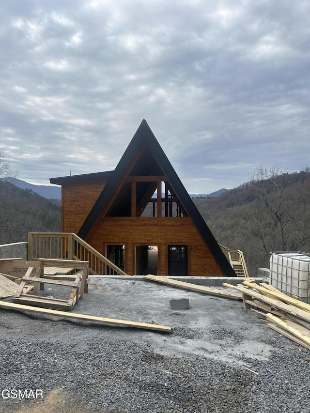view of front of property with a mountain view