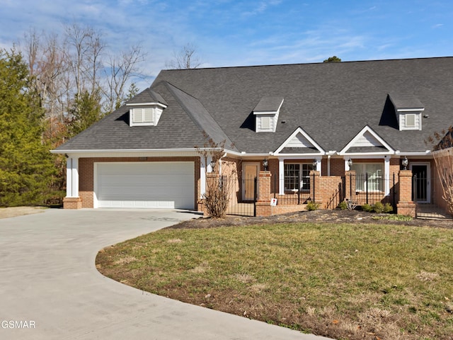 view of front of house featuring a garage, a front yard, and a porch