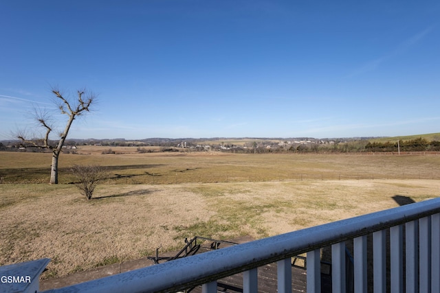 view of yard with a rural view