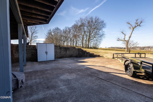 view of patio with a rural view