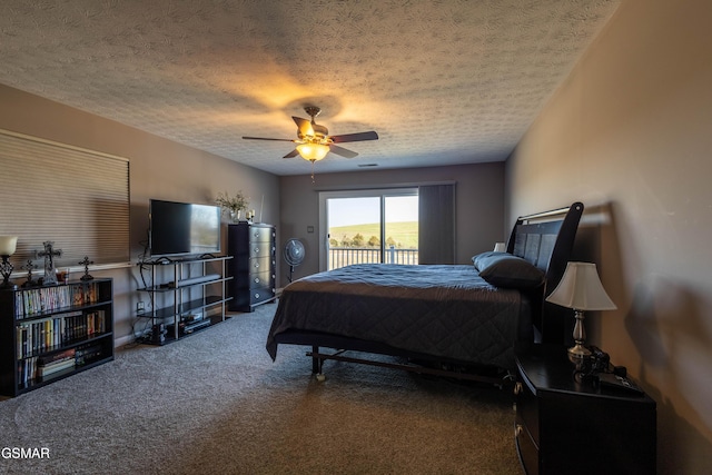 carpeted bedroom with ceiling fan, access to exterior, and a textured ceiling