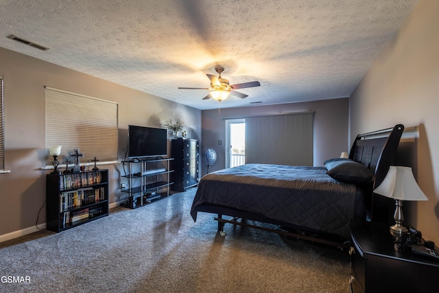 carpeted bedroom featuring a textured ceiling and ceiling fan