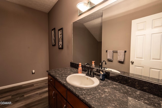 bathroom featuring vanity and hardwood / wood-style floors