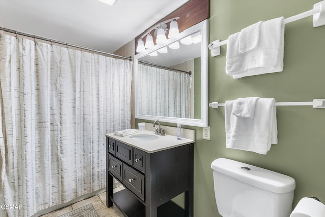 bathroom with tile patterned floors, vanity, toilet, and a shower with curtain