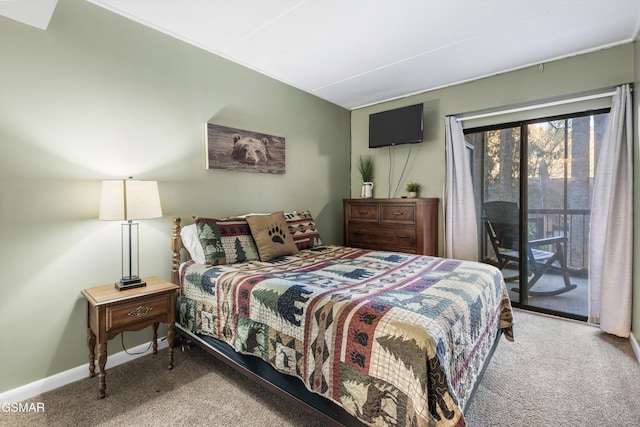 carpeted bedroom featuring access to exterior