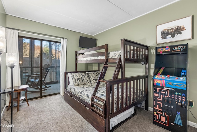 bedroom with access to outside and carpet floors