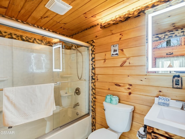 full bathroom with wood ceiling, toilet, combined bath / shower with glass door, and wood walls