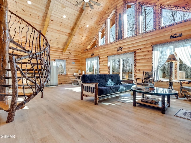 living room featuring hardwood / wood-style flooring, high vaulted ceiling, log walls, wooden ceiling, and beamed ceiling