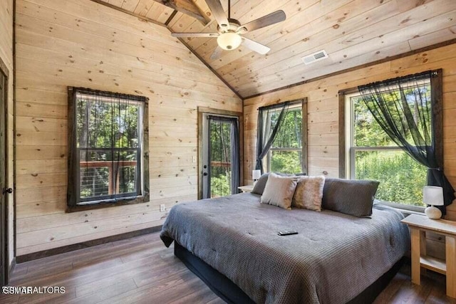 bedroom featuring dark wood-type flooring, vaulted ceiling, multiple windows, and wooden ceiling