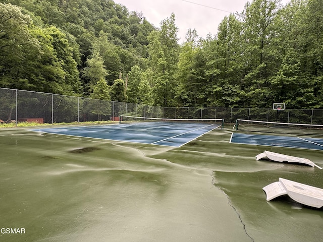 3114 Hatcher Top Rd, Sevierville, TN 37862 - view of tennis court with a forest view