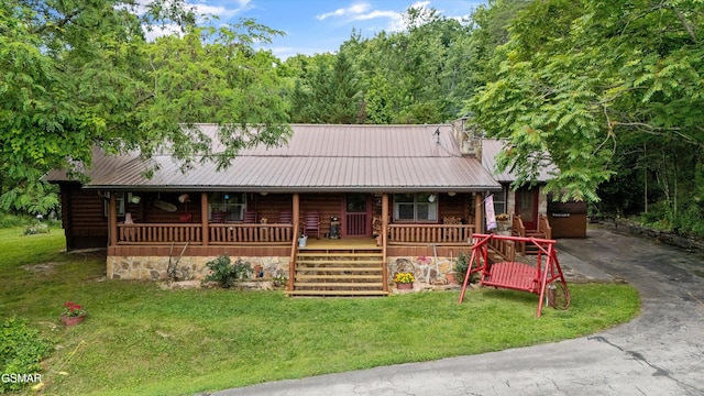 3114 Hatcher Top Rd, Sevierville, TN 37862 - view of front of property featuring a porch, a front yard, and metal roof