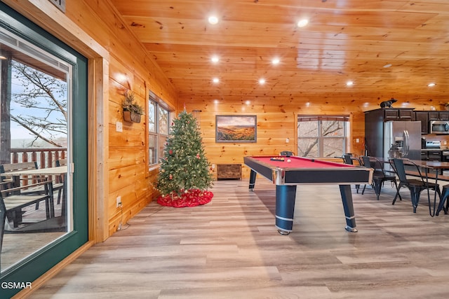 game room featuring wooden ceiling, wooden walls, light hardwood / wood-style floors, and billiards