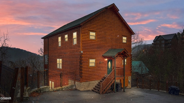 view of property exterior at dusk