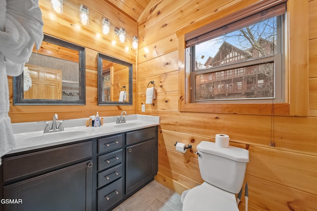 bathroom featuring wooden ceiling, tile patterned floors, wood walls, toilet, and vanity