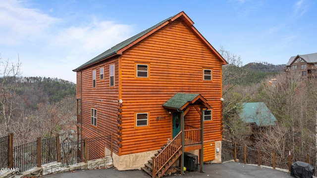 log-style house featuring cooling unit