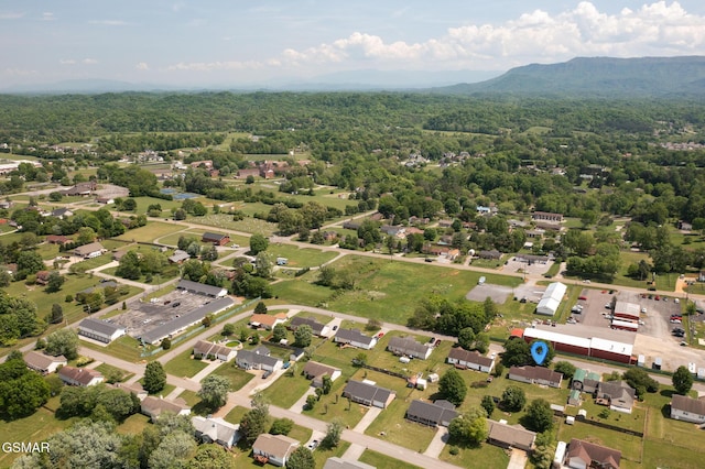 birds eye view of property with a forest view
