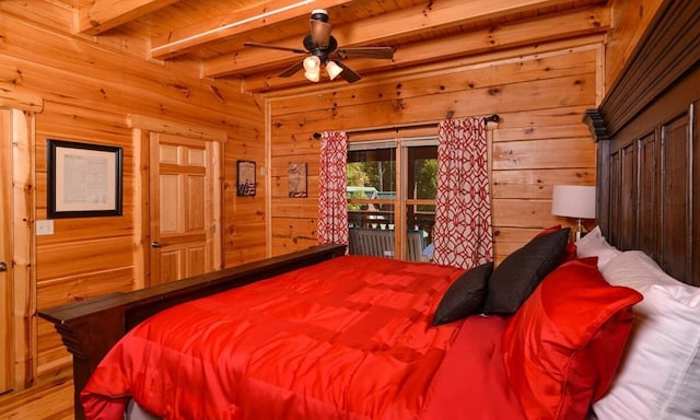 bedroom with wood walls, beam ceiling, and wood ceiling