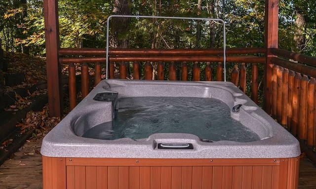 wooden terrace with a hot tub