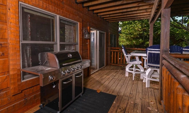 wooden deck featuring grilling area