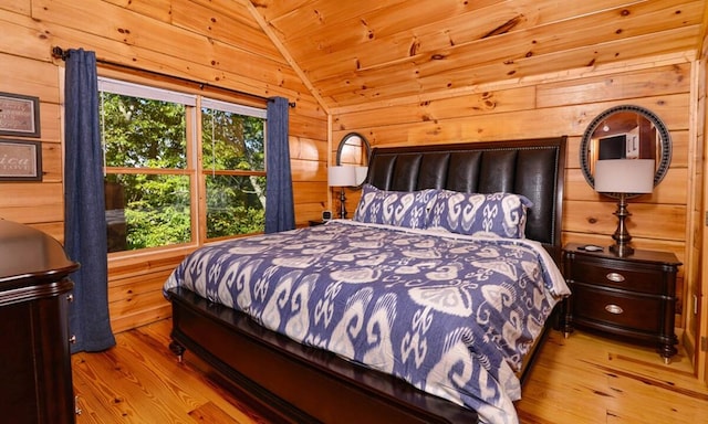 bedroom with wood walls, wood ceiling, lofted ceiling, and light wood-type flooring