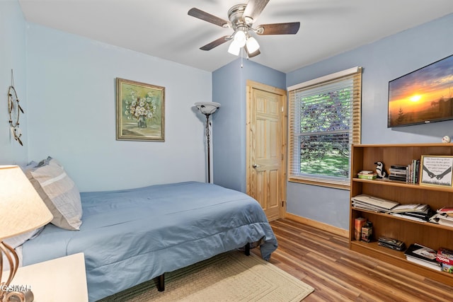 4527 E Scenic Dr, Gatlinburg, TN 37738 - bedroom with baseboards, ceiling fan, and wood finished floors