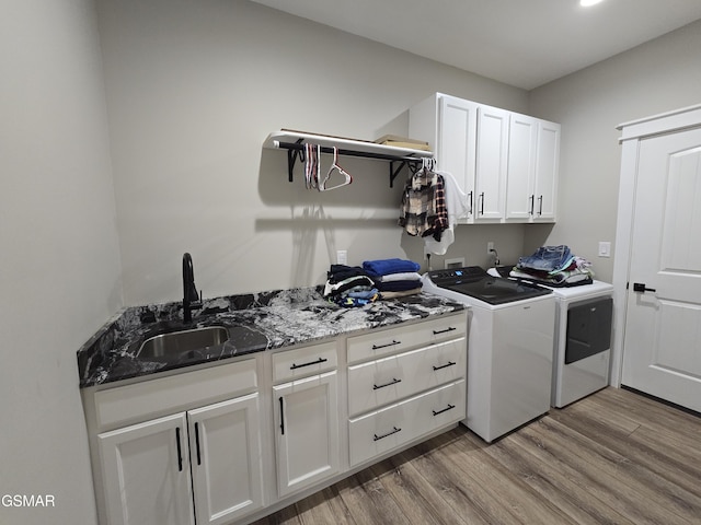708 Lakeside Ct, Dandridge, TN 37725 - laundry room featuring washer and clothes dryer, cabinet space, and wood finished floors