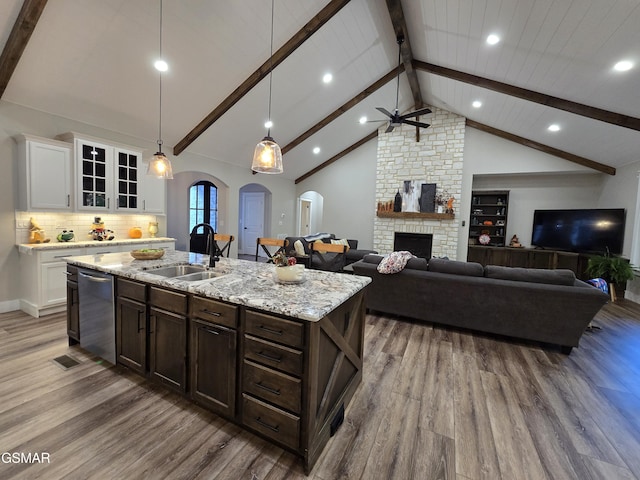 708 Lakeside Ct, Dandridge, TN 37725 - kitchen featuring stainless steel dishwasher, wood finished floors, a sink, a ceiling fan, and arched walkways