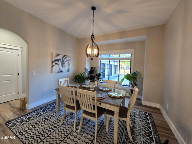 708 Lakeside Ct, Dandridge, TN 37725 - dining room with wood finished floors, baseboards, a chandelier, and arched walkways