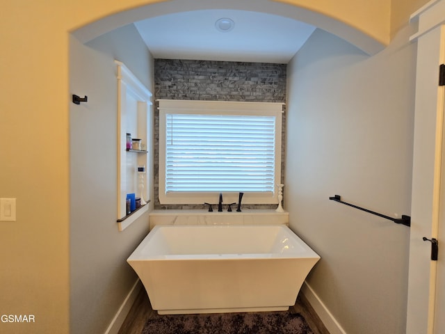 708 Lakeside Ct, Dandridge, TN 37725 - bathroom with a freestanding bath and baseboards