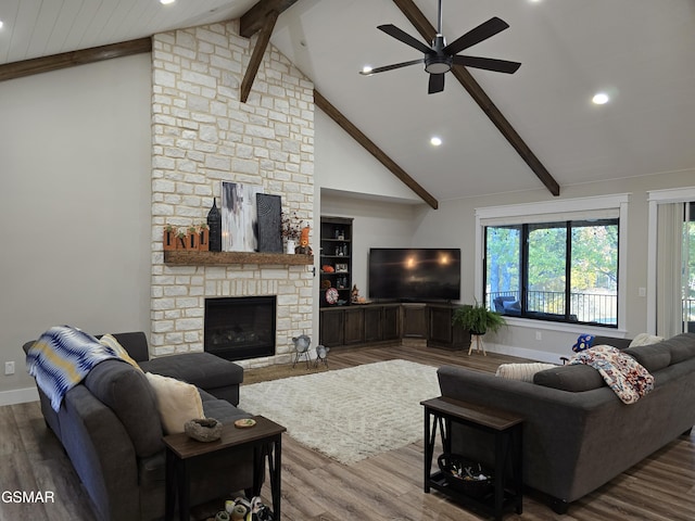 708 Lakeside Ct, Dandridge, TN 37725 - living room with beamed ceiling, wood finished floors, a ceiling fan, recessed lighting, and a stone fireplace