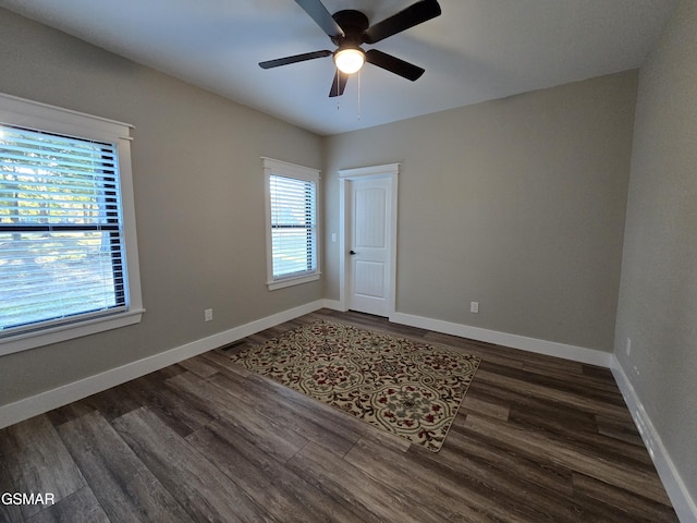 708 Lakeside Ct, Dandridge, TN 37725 - unfurnished room with dark wood-type flooring, ceiling fan, and baseboards