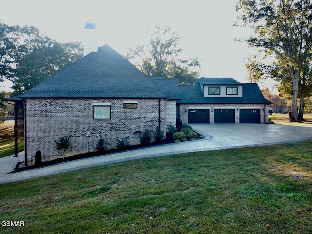 708 Lakeside Ct, Dandridge, TN 37725 - view of side of property with a yard, concrete driveway, and brick siding