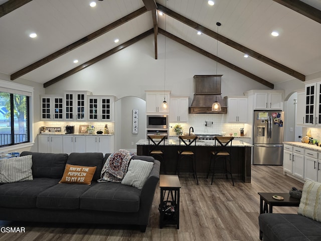 708 Lakeside Ct, Dandridge, TN 37725 - living area featuring arched walkways, recessed lighting, dark wood-style floors, and high vaulted ceiling