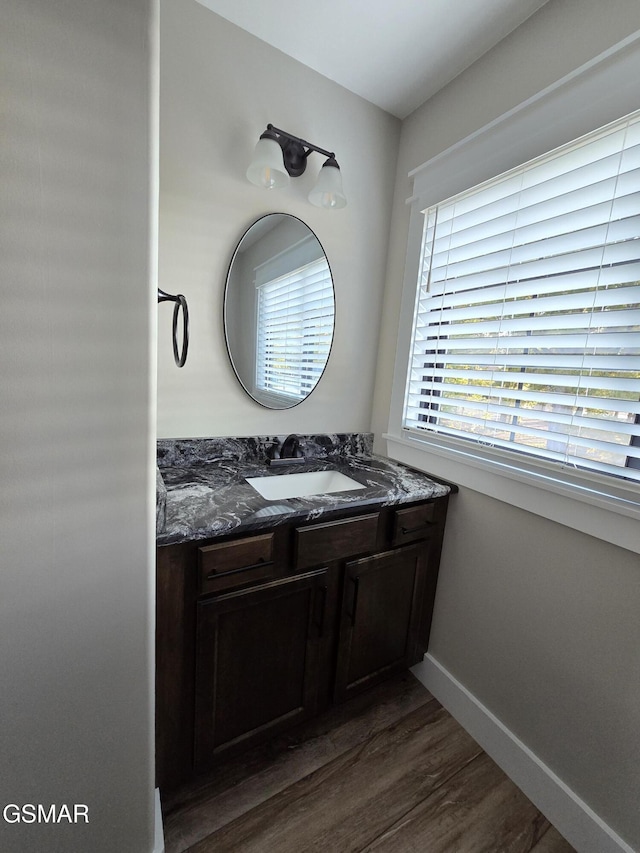 708 Lakeside Ct, Dandridge, TN 37725 - bathroom with wood finished floors, vanity, and baseboards