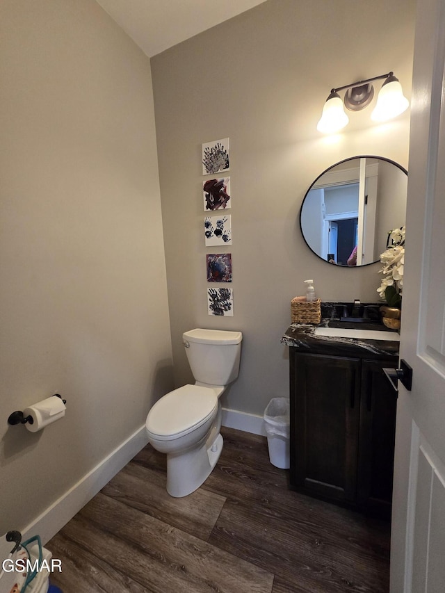 708 Lakeside Ct, Dandridge, TN 37725 - half bathroom with toilet, wood finished floors, vanity, and baseboards