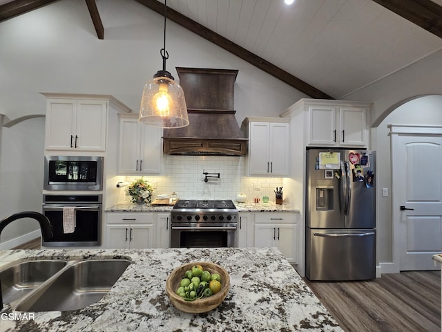 708 Lakeside Ct, Dandridge, TN 37725 - kitchen with appliances with stainless steel finishes, premium range hood, a sink, decorative backsplash, and white cabinets