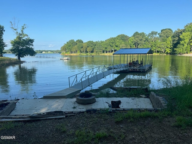 708 Lakeside Ct, Dandridge, TN 37725 - dock area featuring a water view, a wooded view, and an outdoor fire pit