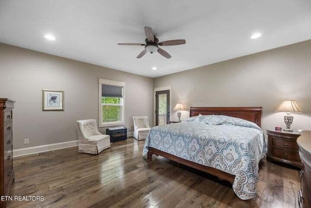 bedroom featuring ceiling fan and dark hardwood / wood-style floors