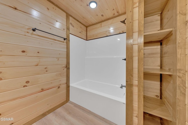 2641 Willow Heights Way, Sevierville, TN 37876 - bathroom with wood walls, a tub, wood finished floors, wooden ceiling, and a shower