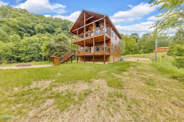 2641 Willow Heights Way, Sevierville, TN 37876 - back of house featuring stairway, a deck, a lawn, and a wooded view