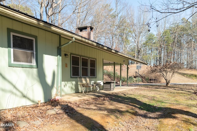 view of side of home featuring a patio