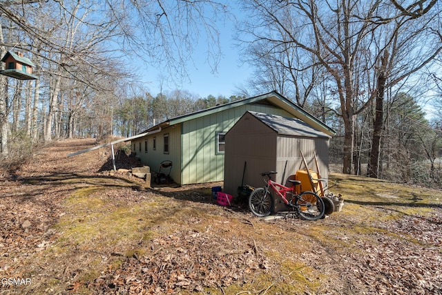 view of home's exterior with an outdoor structure