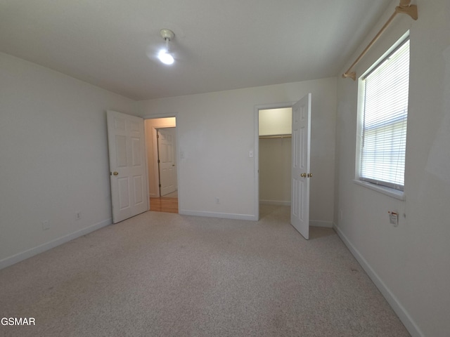 2865/2869 Happy Hollow Rd, Sevierville, TN 37862 - unfurnished bedroom featuring light carpet and a spacious closet