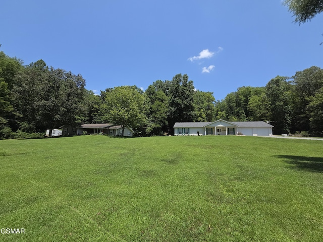 2865/2869 Happy Hollow Rd, Sevierville, TN 37862 - view of green lawn featuring a garage