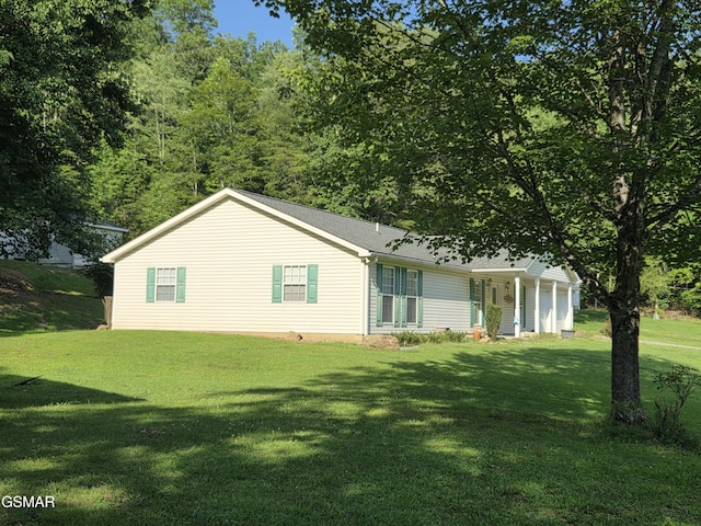 2865/2869 Happy Hollow Rd, Sevierville, TN 37862 - view of property exterior with a lawn